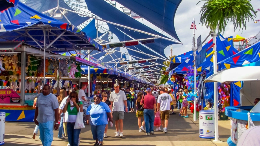 Vistors enjoy food, games and the festivities of the State Fair of Texas in Dallas.